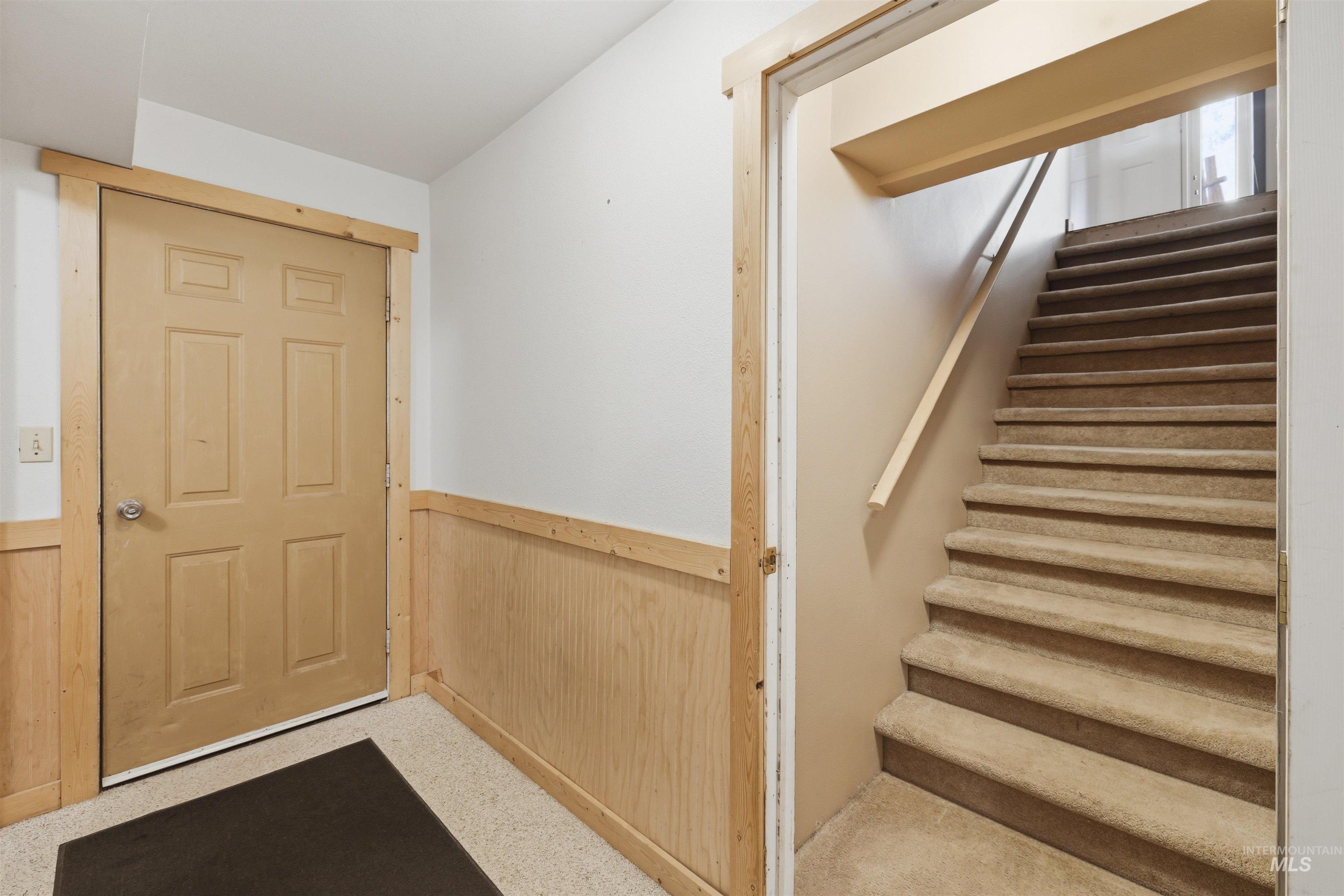 95 Johnson Creek Road Boise, ID 83716 - Photo 35 of 49 Stairway featuring wainscoting