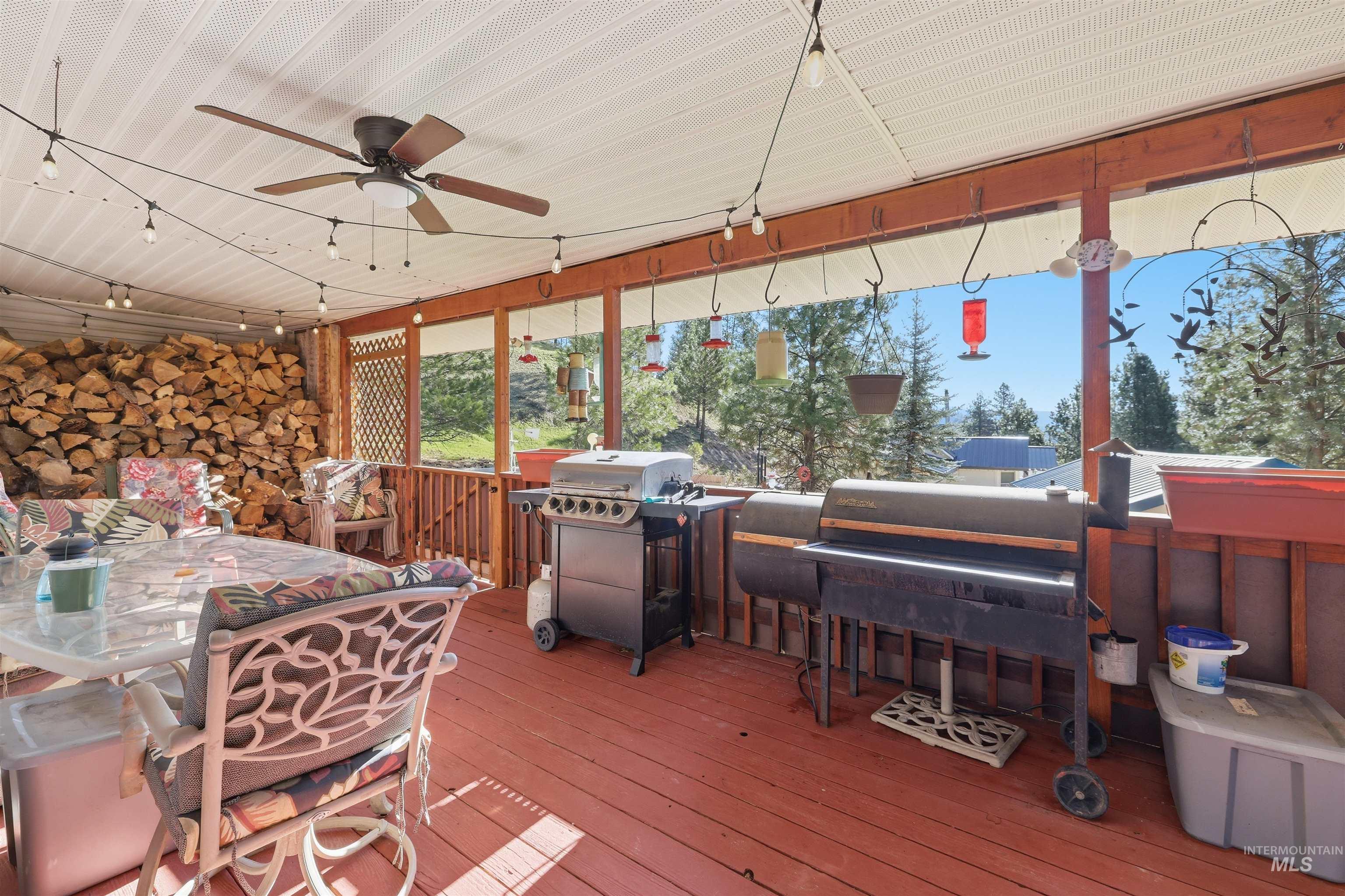 95 Johnson Creek Road Boise, ID 83716 - Photo 40 of 49 Wooden deck with outdoor dining area, ceiling fan, and area for grilling