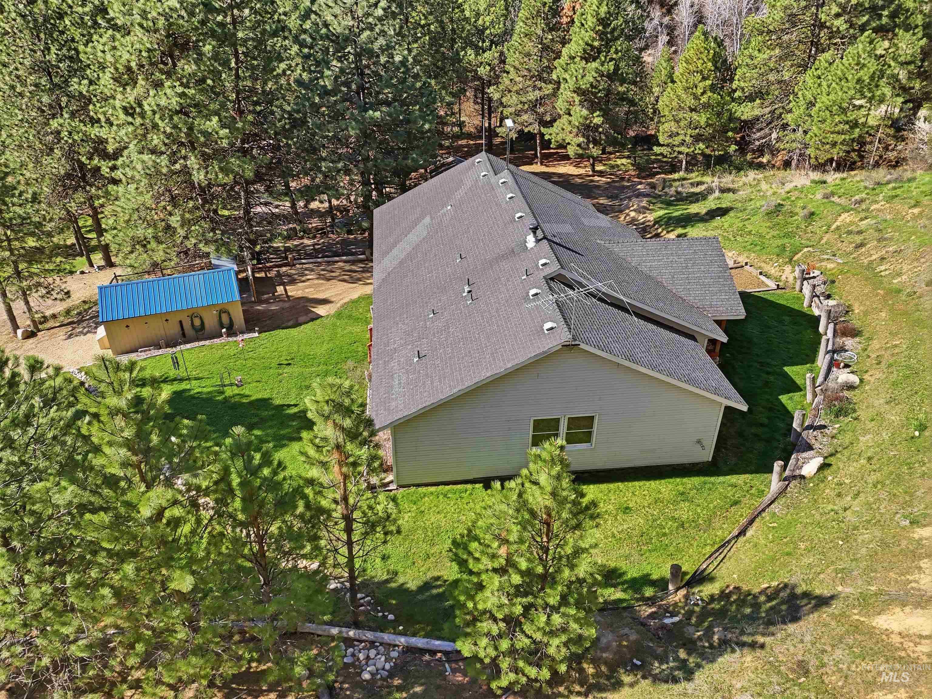 95 Johnson Creek Road Boise, ID 83716 - Photo 4 of 49 View of subject property featuring a tree filled landscape