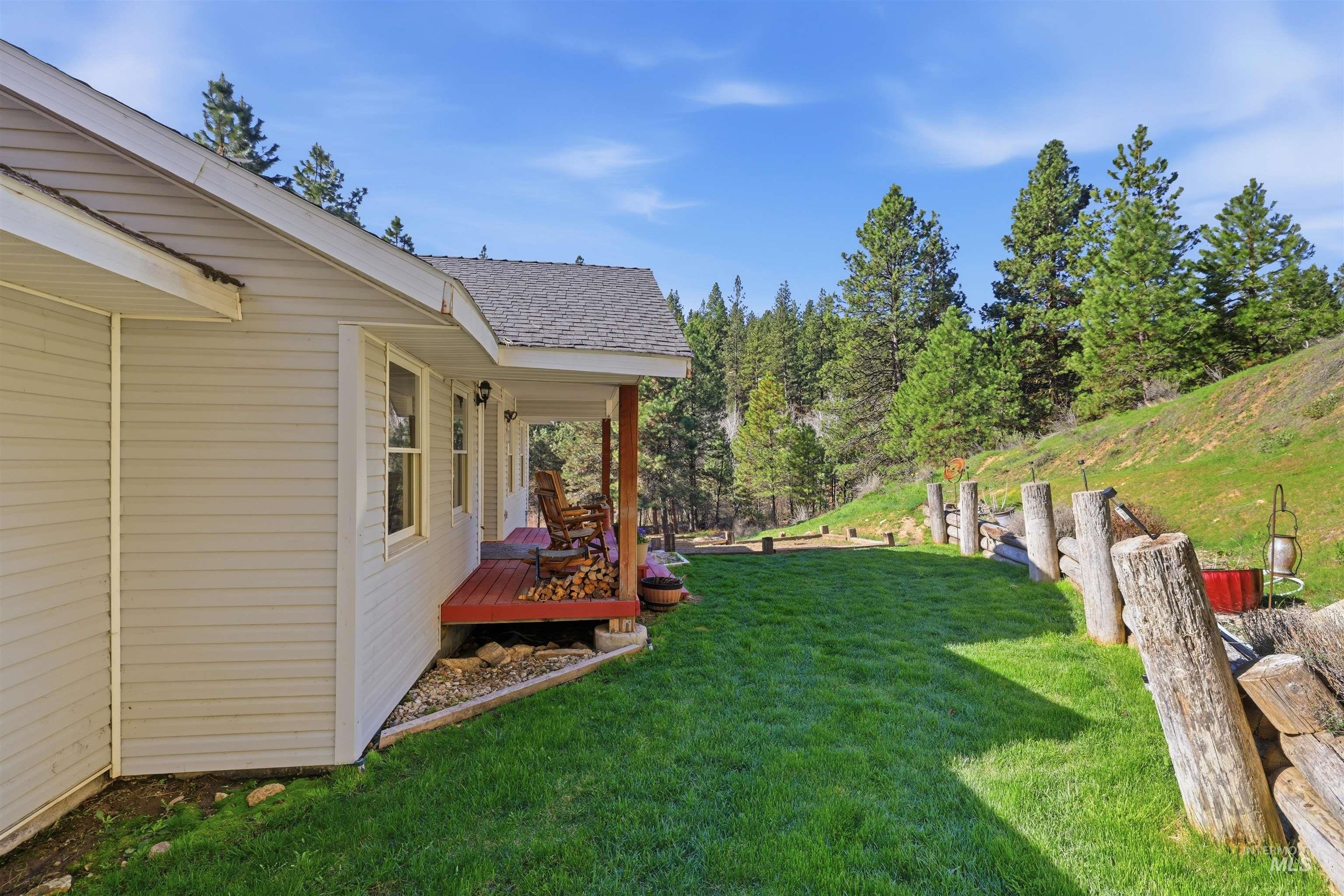 95 Johnson Creek Road Boise, ID 83716 - Photo 44 of 49 View of grassy yard featuring a deck