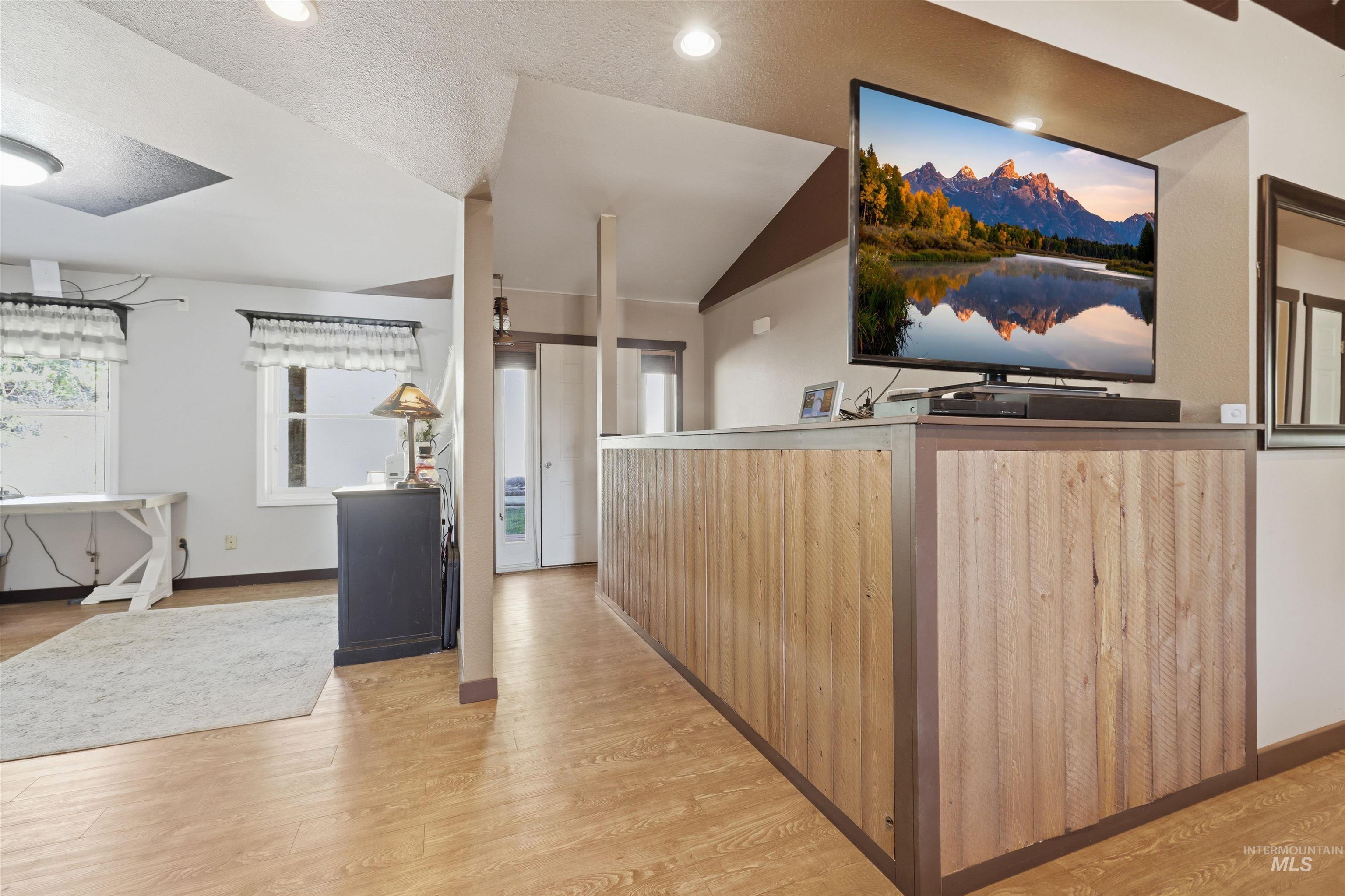 95 Johnson Creek Road Boise, ID 83716 - Photo 10 of 49 Kitchen with light wood-type flooring and recessed lighting