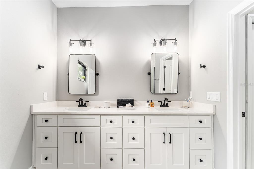 9 Middleground Road Ocala, FL 34482 - Photo 24 of 42 a bathroom with a double vanity sink mirror and