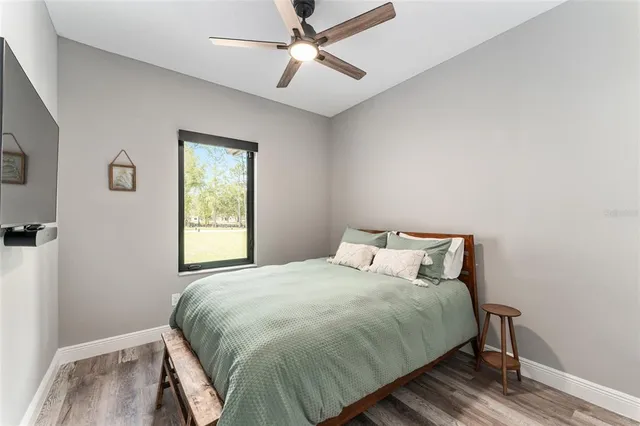 a bedroom with a bed and window