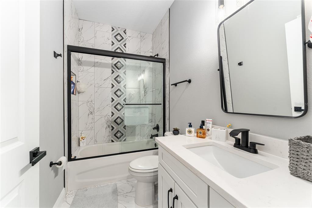 9 Middleground Road Ocala, FL 34482 - Photo 29 of 42 a bathroom with a sink toilet and shower