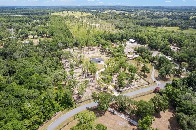 a view of a garden with a building in the background