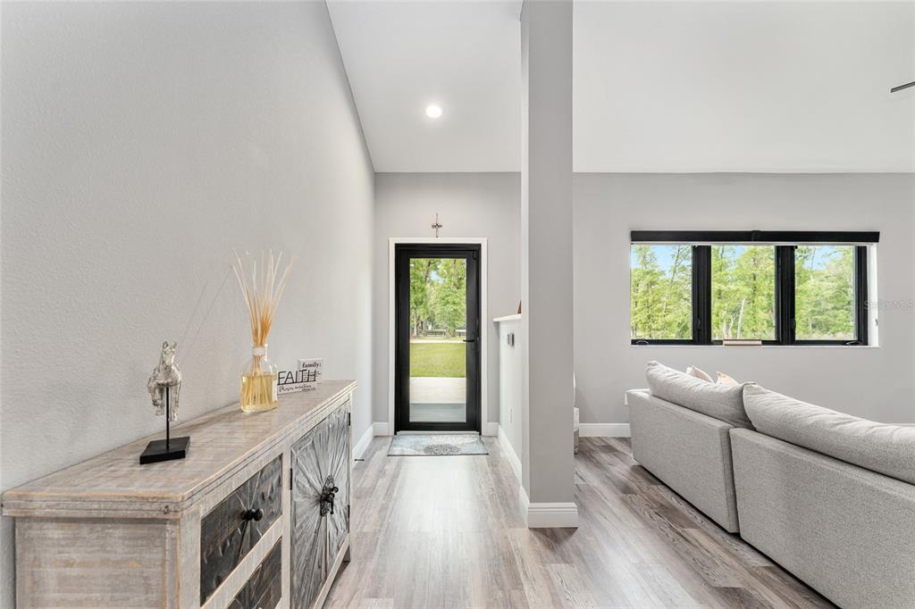 9 Middleground Road Ocala, FL 34482 - Photo 9 of 42 a living room with furniture and a large window