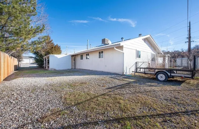 a view of a backyard of the house