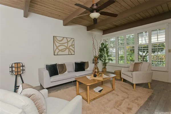 a living room with furniture and a large window
