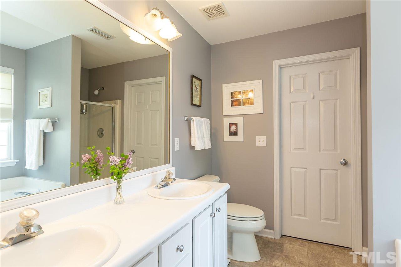 4009 Hopper Street Raleigh, NC 27616 - Photo 16 of 25 Dual vanities and walk-in closet.