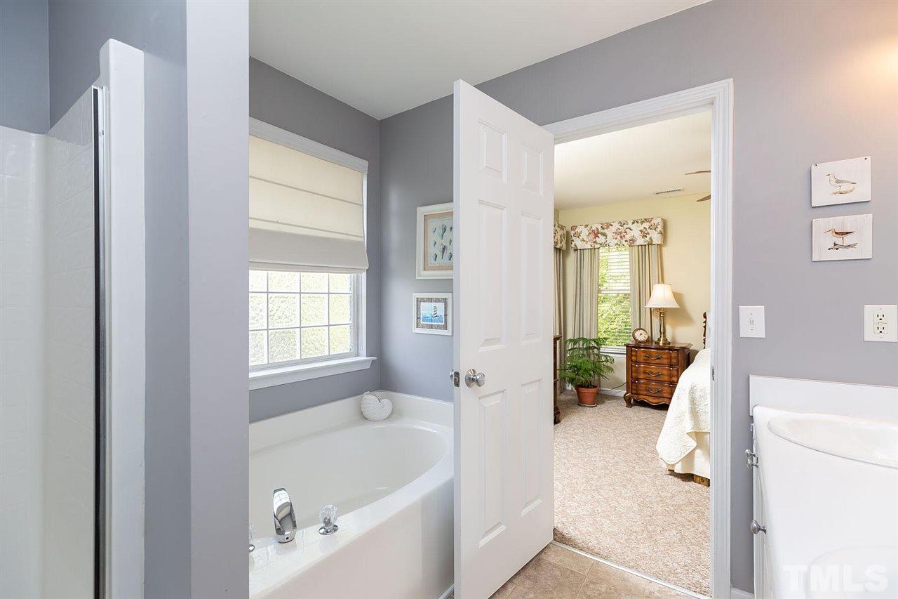 4009 Hopper Street Raleigh, NC 27616 - Photo 17 of 25 Serene bath with lots of light and garden tub.
