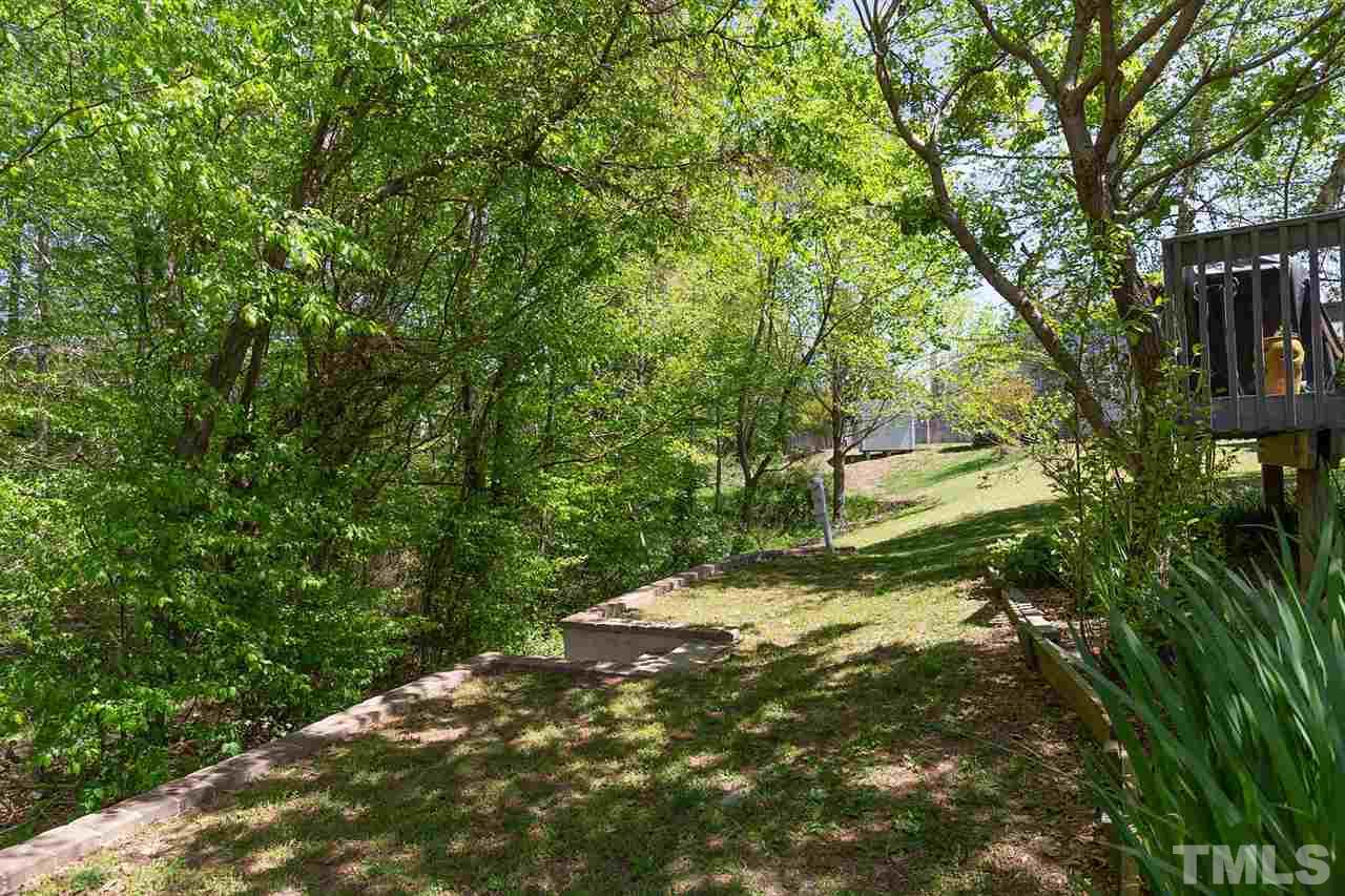 4009 Hopper Street Raleigh, NC 27616 - Photo 21 of 25 Lovely backyard. Mature trees, privacy, and overlooks creek.