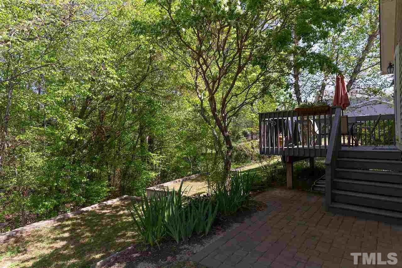 4009 Hopper Street Raleigh, NC 27616 - Photo 22 of 25 Griliing patio and deck overlook the private backyard.