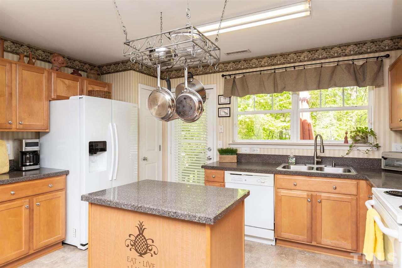 4009 Hopper Street Raleigh, NC 27616 - Photo 7 of 25 Kitchen overlooks private backyard.