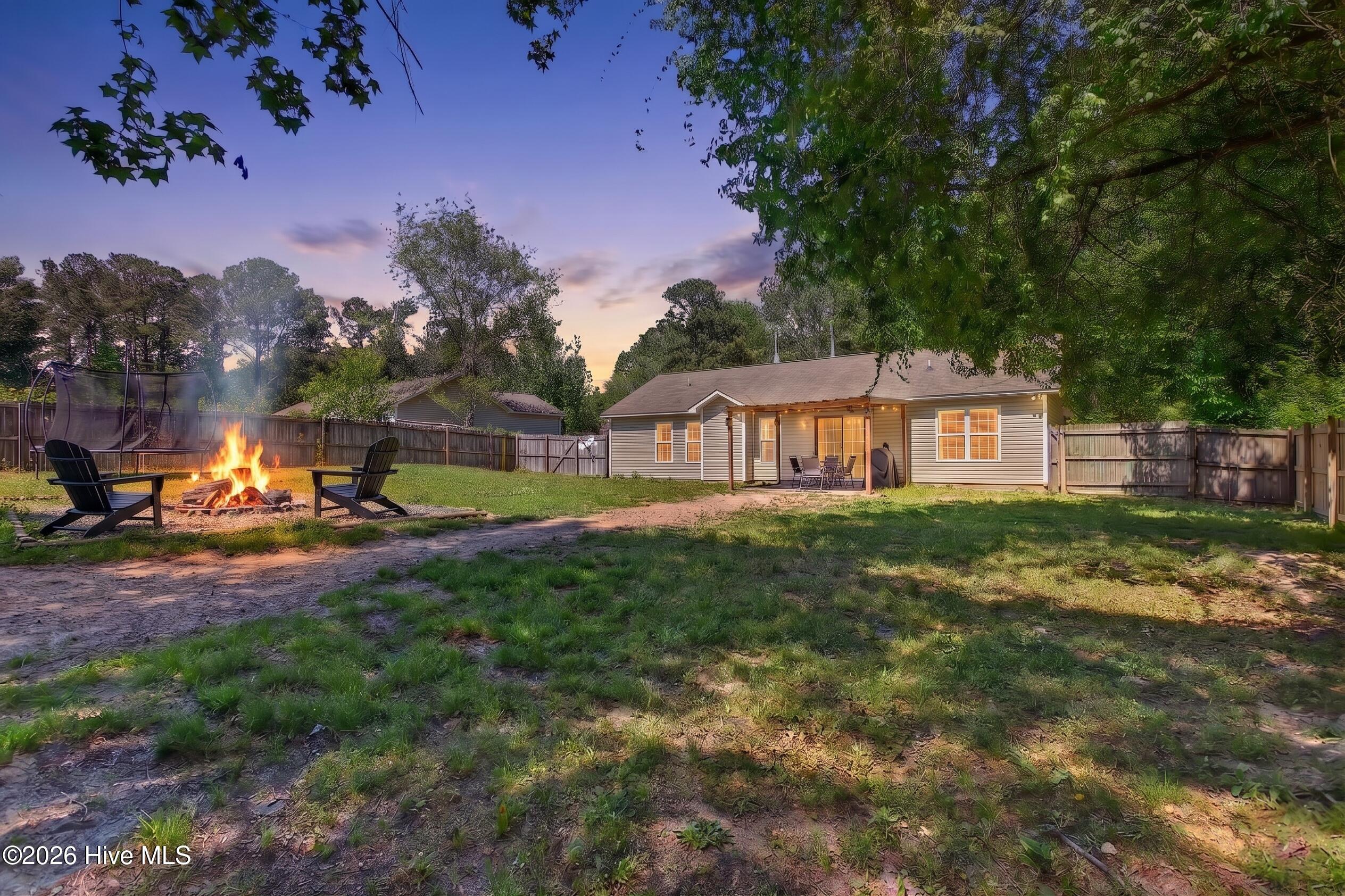 112 Clayton James Road Jacksonville, NC 28540 - Photo 3 of 26 112 Clayton James Backyard Twilight Fire