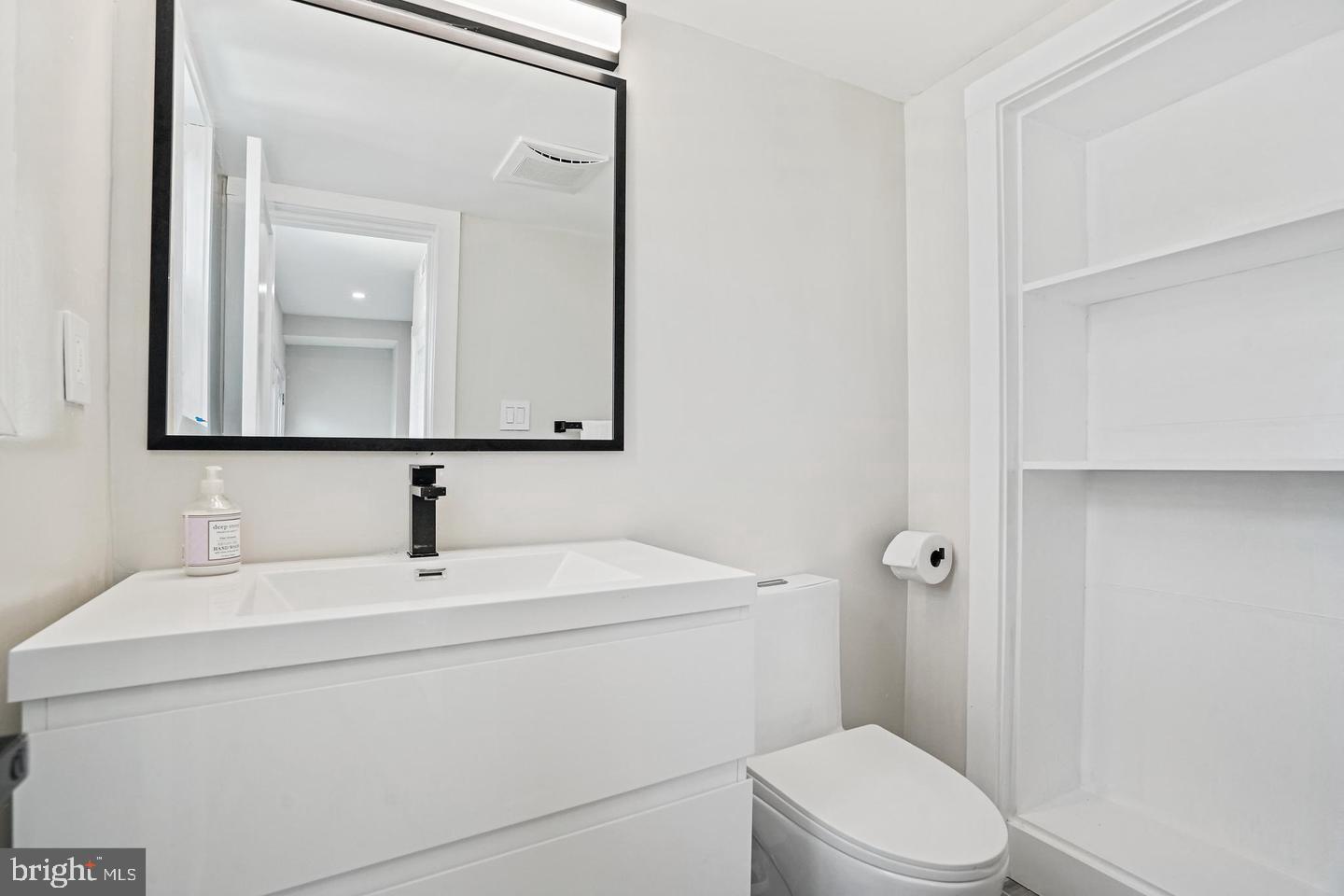 719 Quebec Place Northwest Washington, DC 20010 - Photo 14 of 32 Sleek modern bathroom with minimalist design.