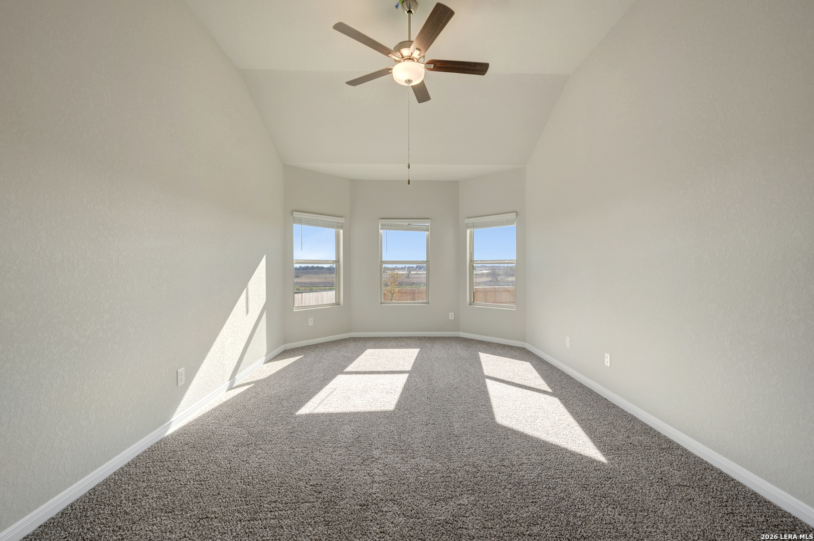 10330 Goodison Drive Converse, TX 78109 - Photo 19 of 42 wooden floor in an empty room with a window