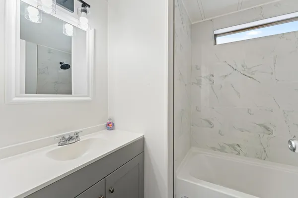 a bathroom with a sink and a bathtub