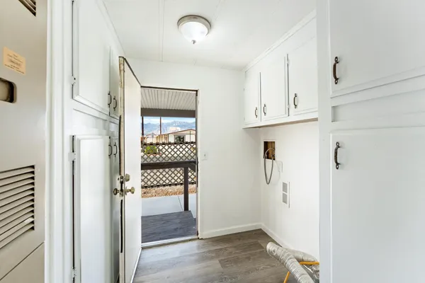 an entryway of a house and an empty room