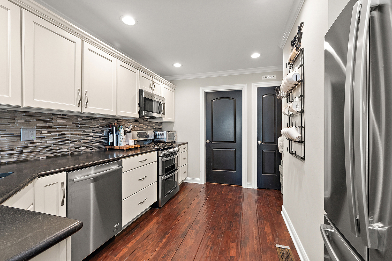 8237 Pecan Place Frankfort, IL 60423 - Photo 12 of 39 a kitchen with stainless steel appliances a refrigerator sink and microwave