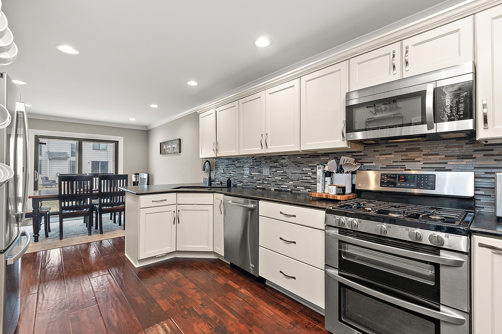 8237 Pecan Place Frankfort, IL 60423 - Photo 13 of 39 a kitchen with stainless steel appliances granite countertop a stove and cabinets