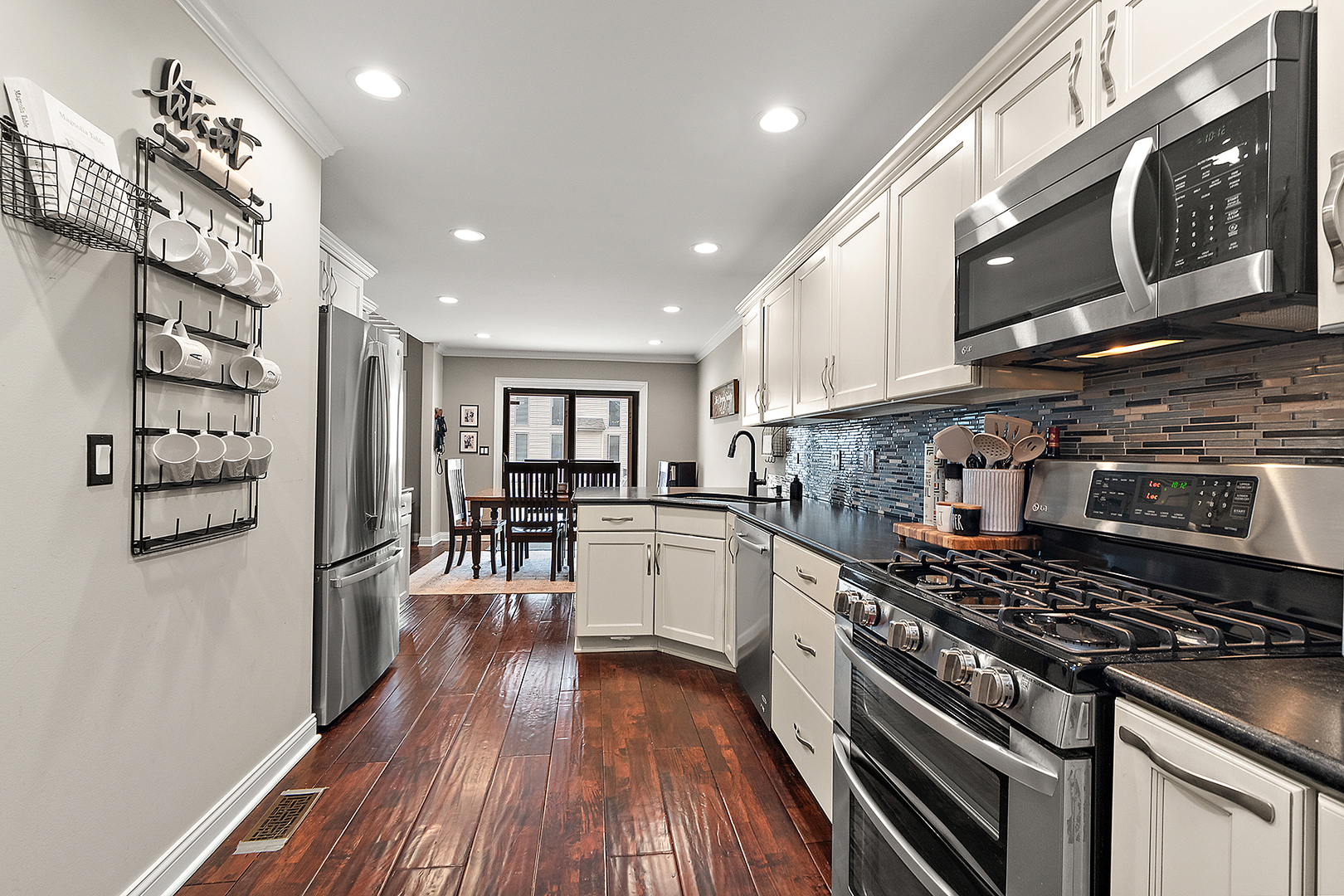 8237 Pecan Place Frankfort, IL 60423 - Photo 14 of 39 a kitchen with stove and wooden floor