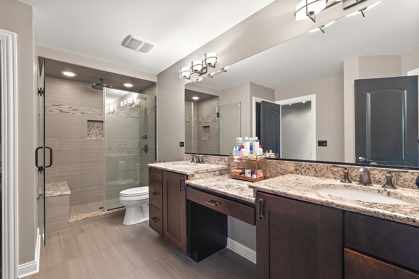 8237 Pecan Place Frankfort, IL 60423 - Photo 18 of 39 a bathroom with a double vanity sink toilet and shower