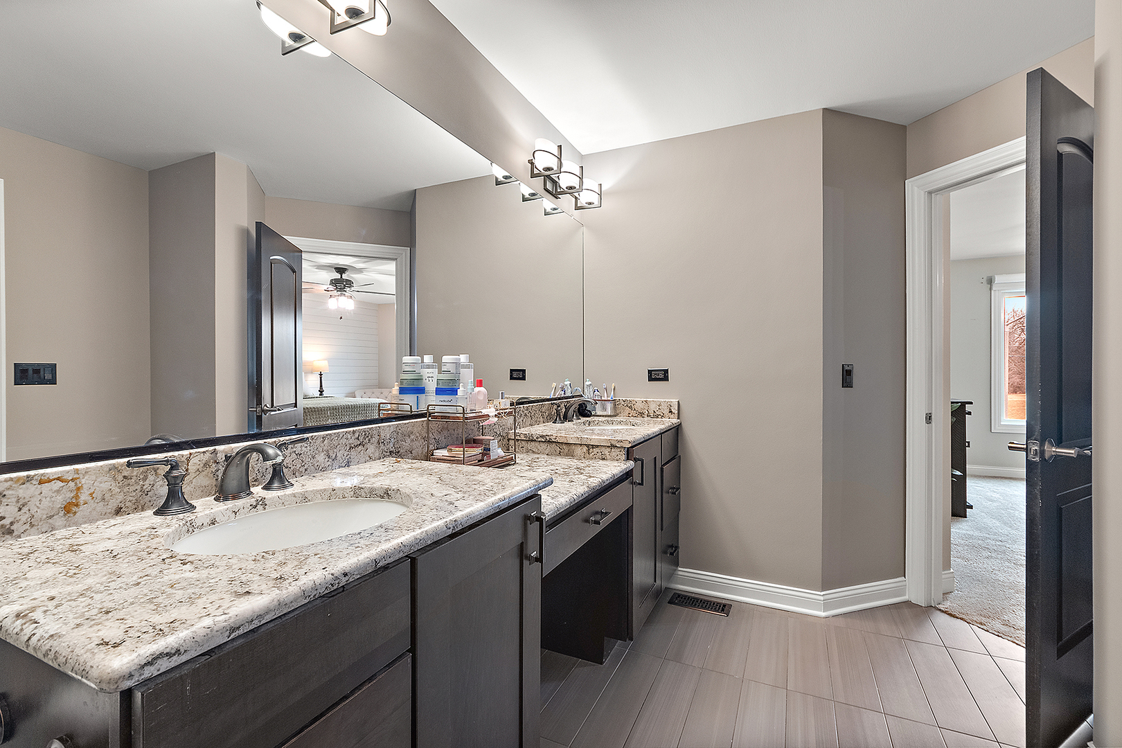 8237 Pecan Place Frankfort, IL 60423 - Photo 20 of 39 a bathroom with a granite countertop sink and a mirror
