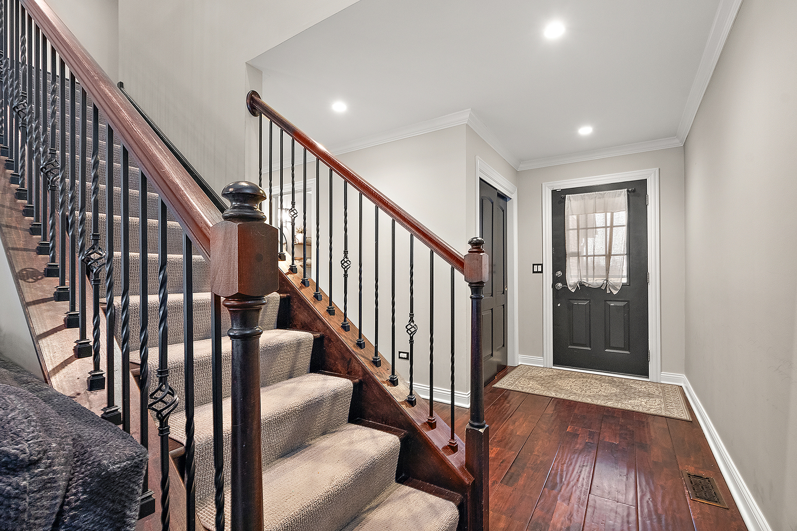 8237 Pecan Place Frankfort, IL 60423 - Photo 4 of 39 a view of staircase with wooden floor and stairs