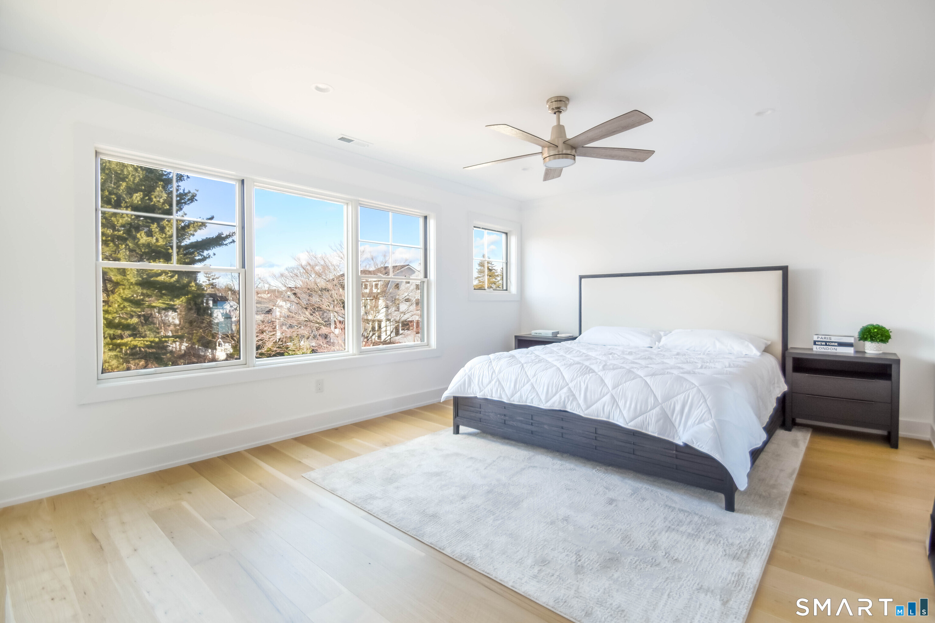 a bedroom with a large bed and a window