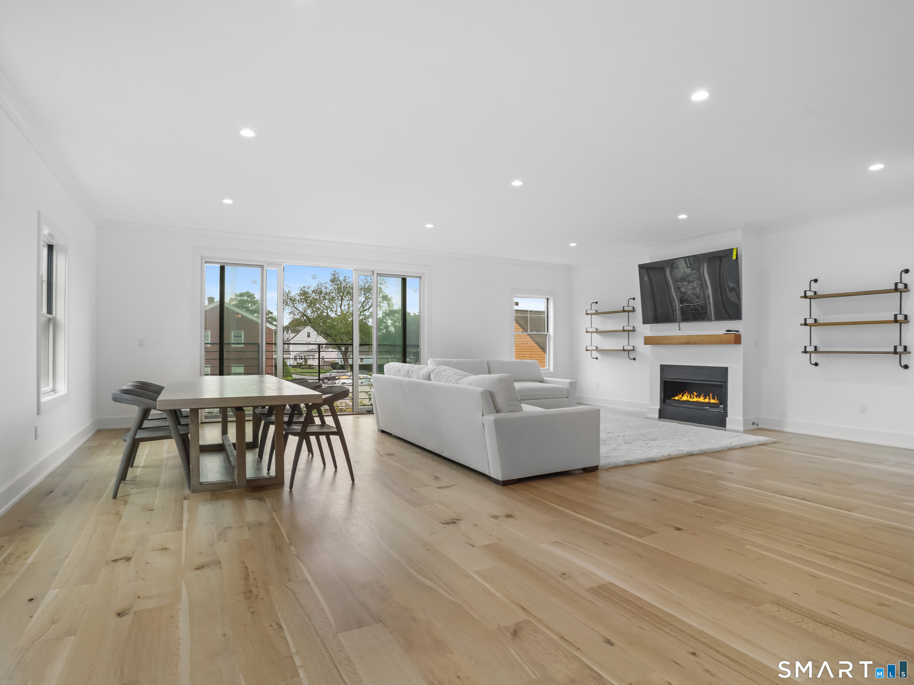 345 Reef Road, Unit C9 Fairfield, CT 06824 - Photo 13 of 32 a living room with furniture and a fireplace