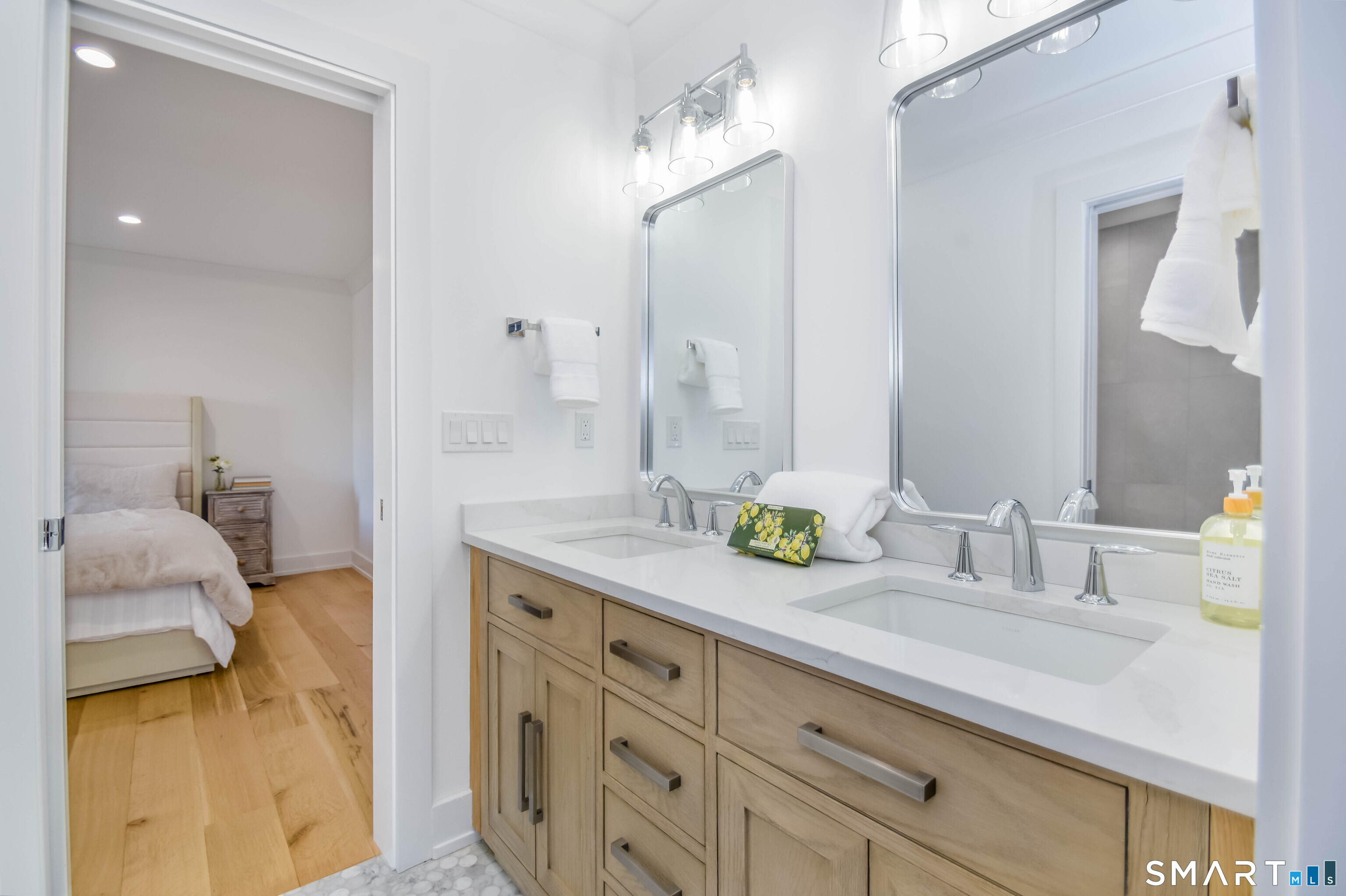 345 Reef Road, Unit C9 Fairfield, CT 06824 - Photo 2 of 32 a spacious bathroom with a granite countertop sink and a mirror