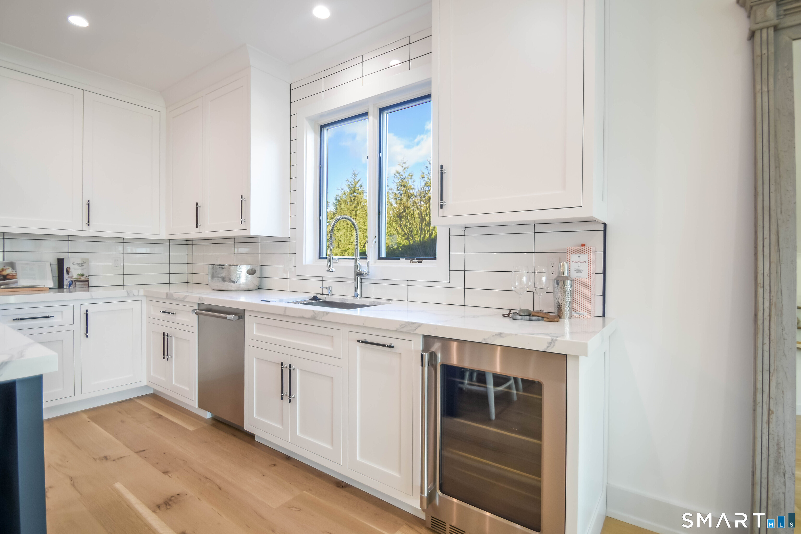 345 Reef Road, Unit C9 Fairfield, CT 06824 - Photo 27 of 32 a kitchen with a sink stove and cabinets
