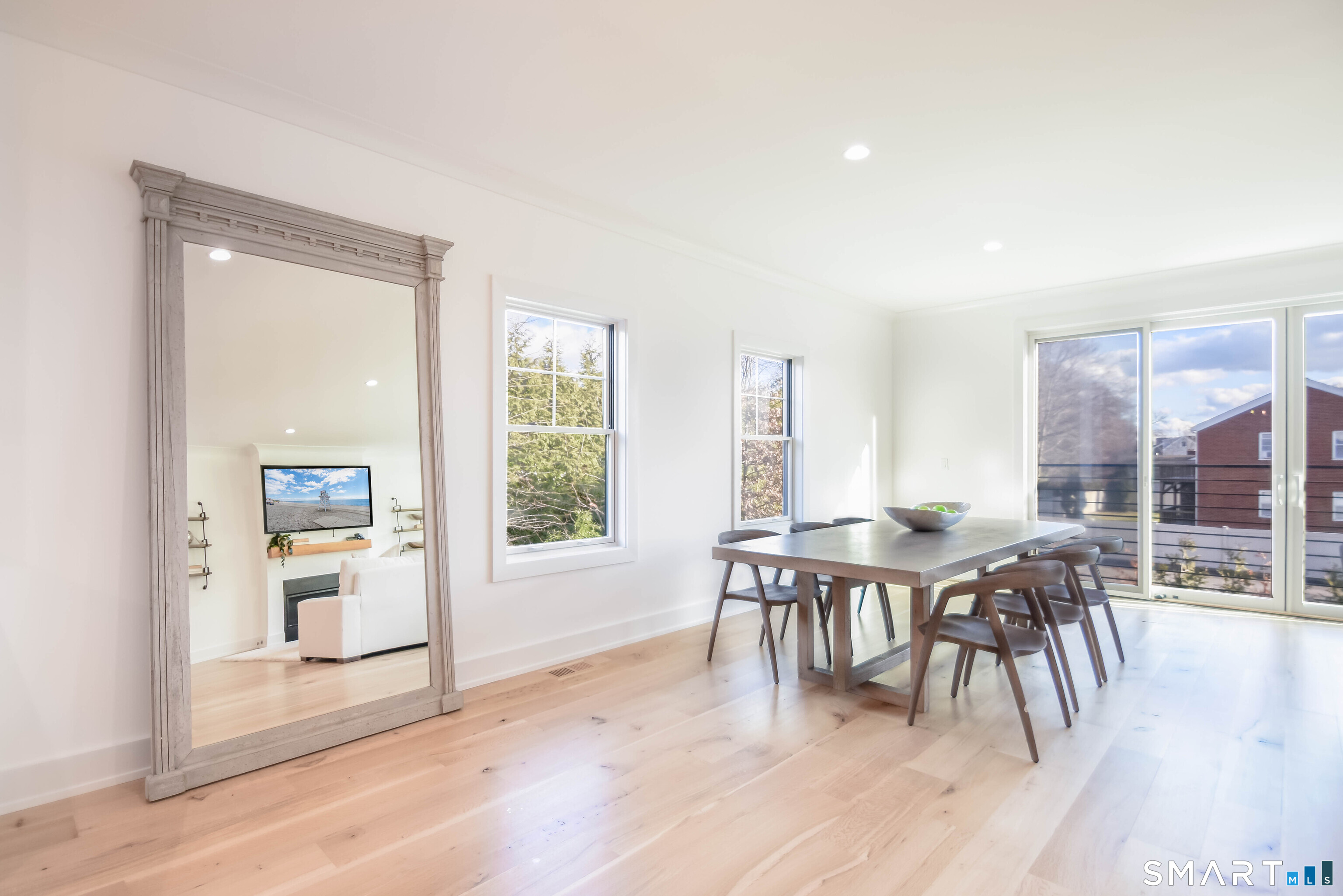 345 Reef Road, Unit C9 Fairfield, CT 06824 - Photo 28 of 32 a view of a dining room with furniture and wooden floor