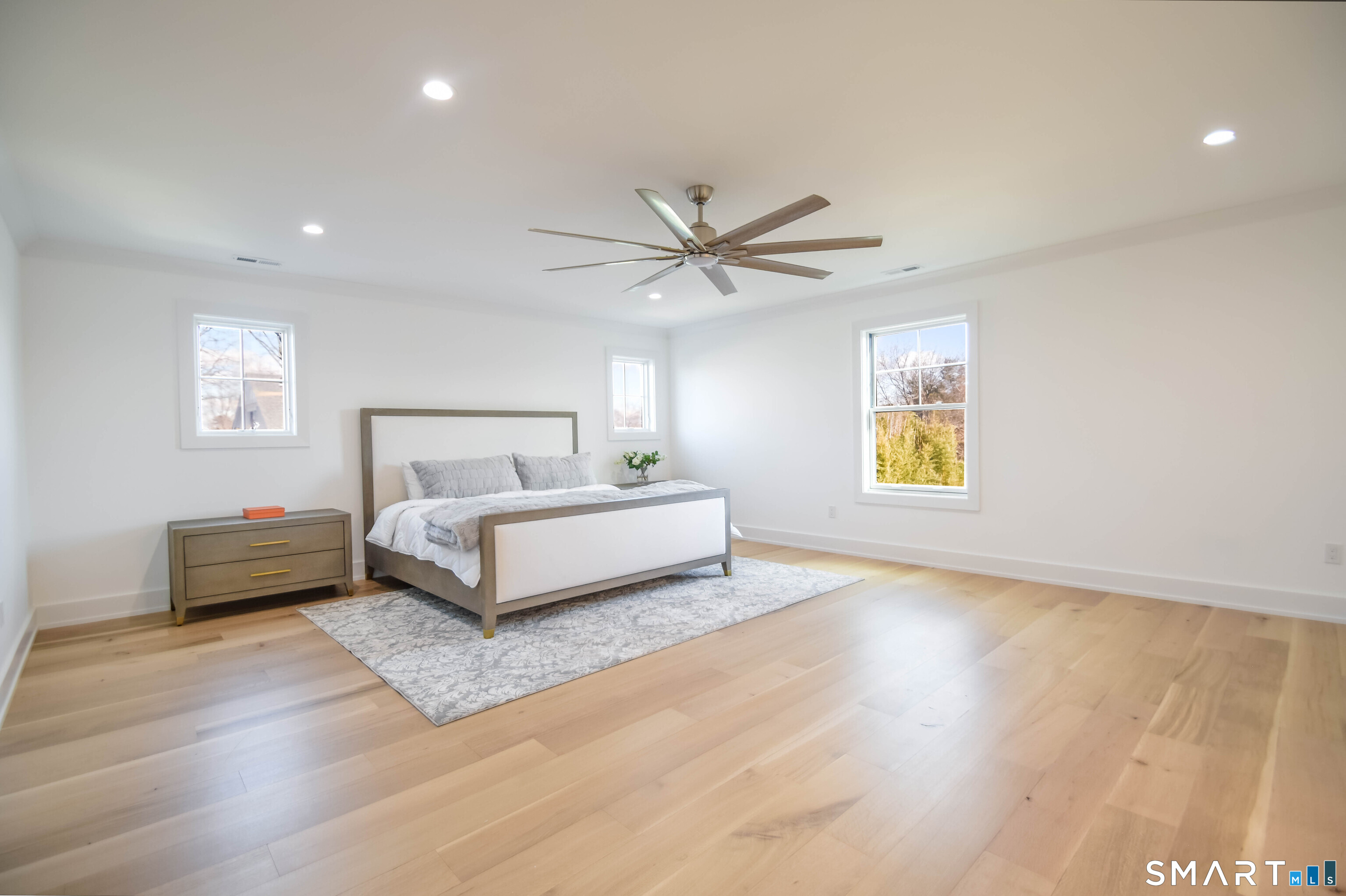 345 Reef Road, Unit C9 Fairfield, CT 06824 - Photo 5 of 32 a bedroom with a bed and a window