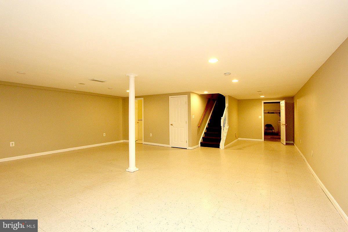 17216 Donora Road Silver Spring, MD 20905 - Photo 24 of 28 a view of an empty room with wooden floor