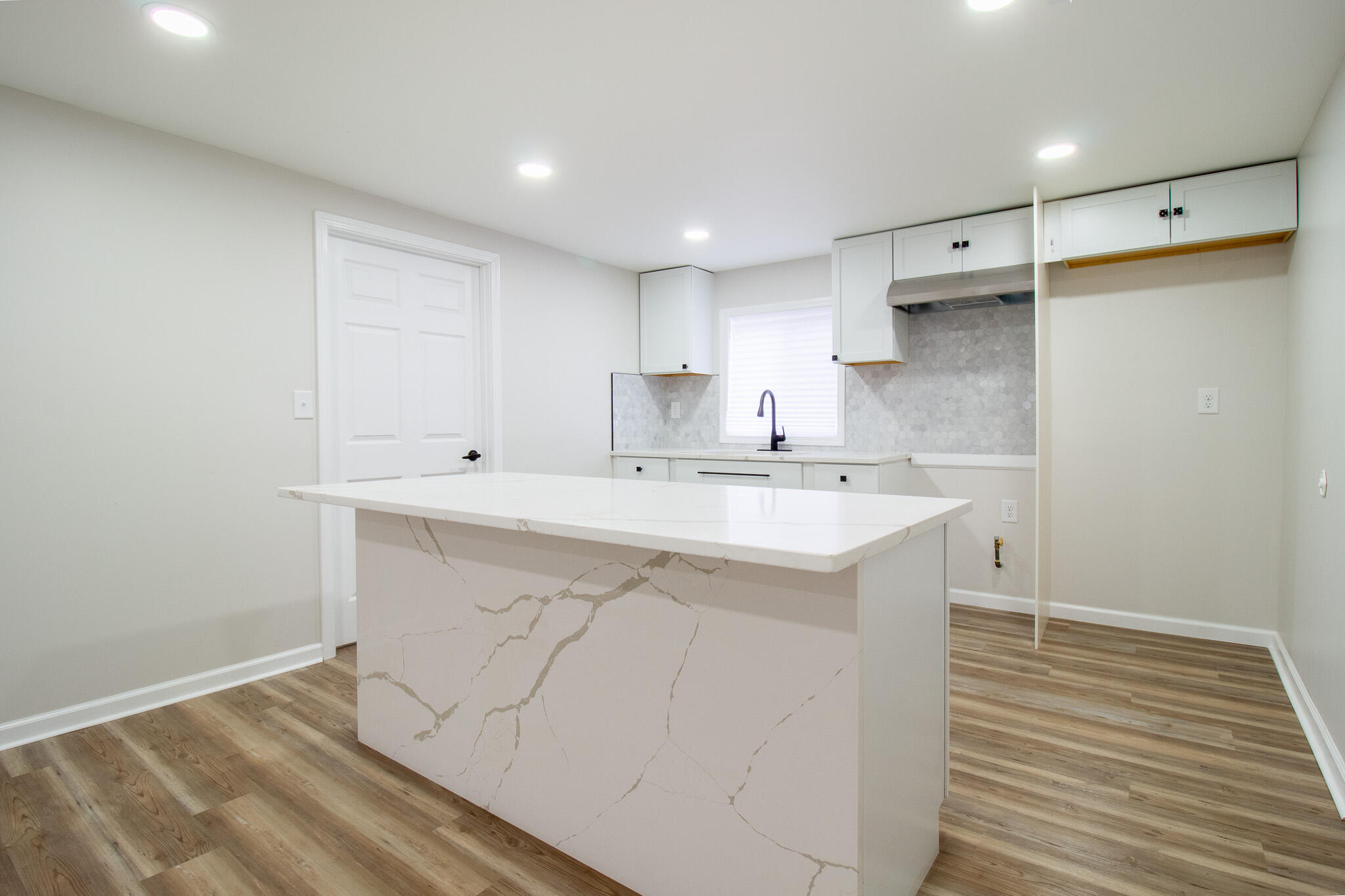 1755 Ralston Street Gary, IN 46406 - Photo 10 of 29 a kitchen with a sink cabinets and wooden floor