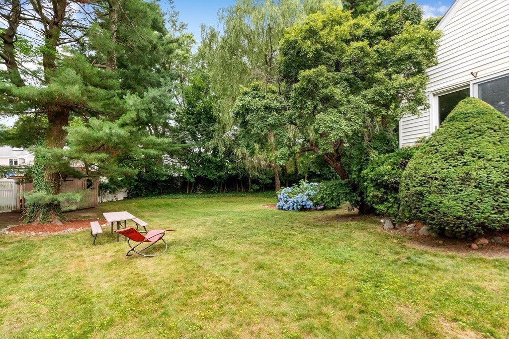 44 Westlund Road Belmont, MA 02478 - Photo 17 of 30 a backyard of a house with a yard and outdoor seating