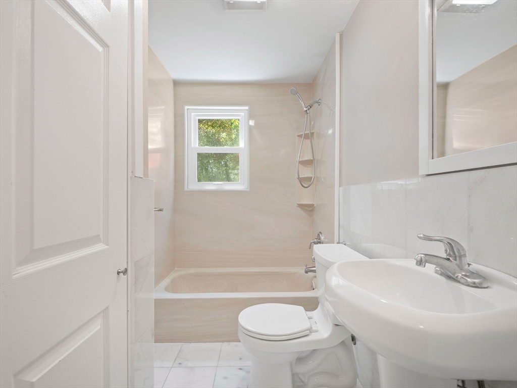 44 Westlund Road Belmont, MA 02478 - Photo 7 of 30 a bathroom with a sink toilet and shower