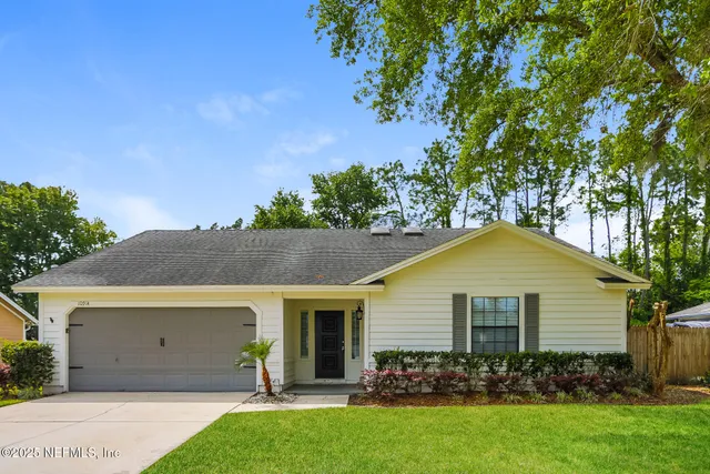a view of a yard in front of a house