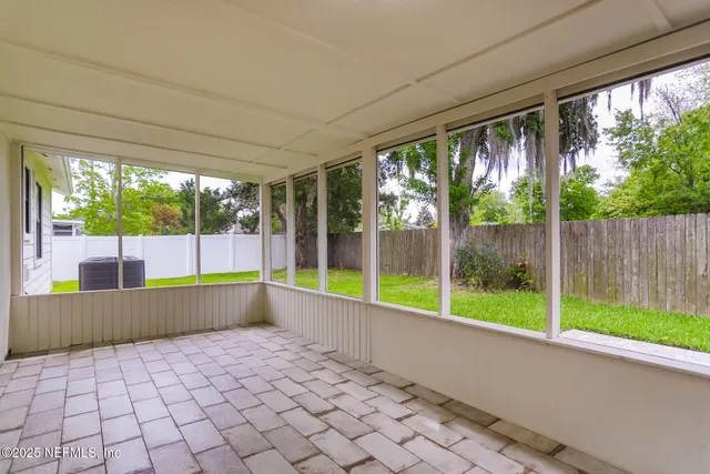 a view of swimming pool with an outdoor seating