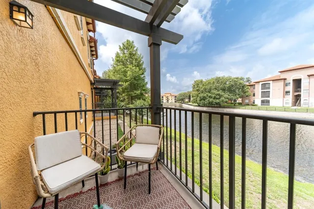a view of a two chairs in the balcony