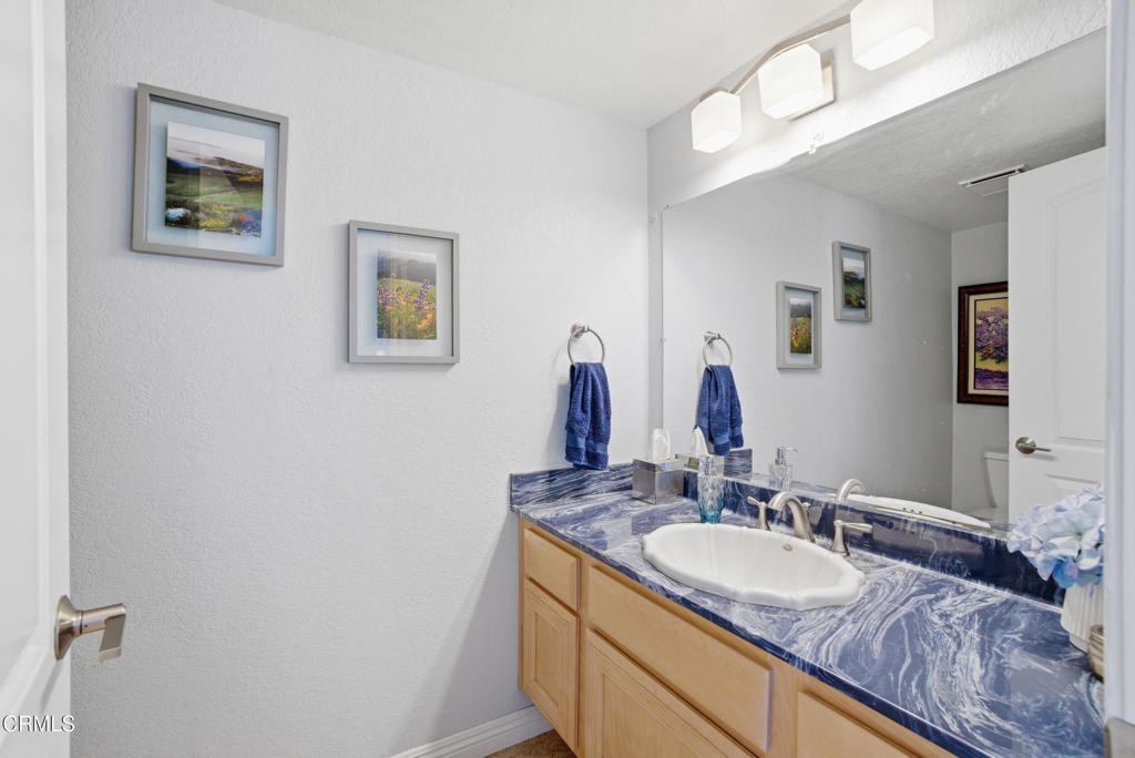 1288 Old Ranch Road Camarillo, CA 93012 - Photo 21 of 61 a bathroom with a granite countertop sink and a mirror