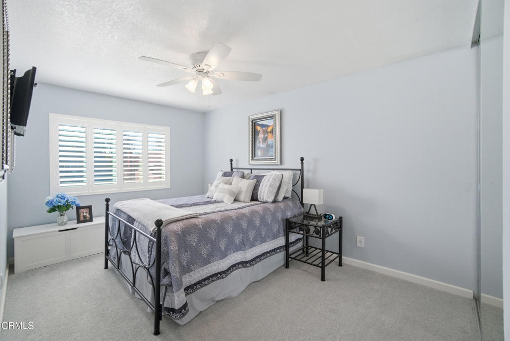 1288 Old Ranch Road Camarillo, CA 93012 - Photo 24 of 61 a bed room with a bed and a chandelier