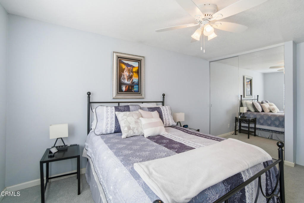 1288 Old Ranch Road Camarillo, CA 93012 - Photo 25 of 61 a bedroom with a bed and a chandelier