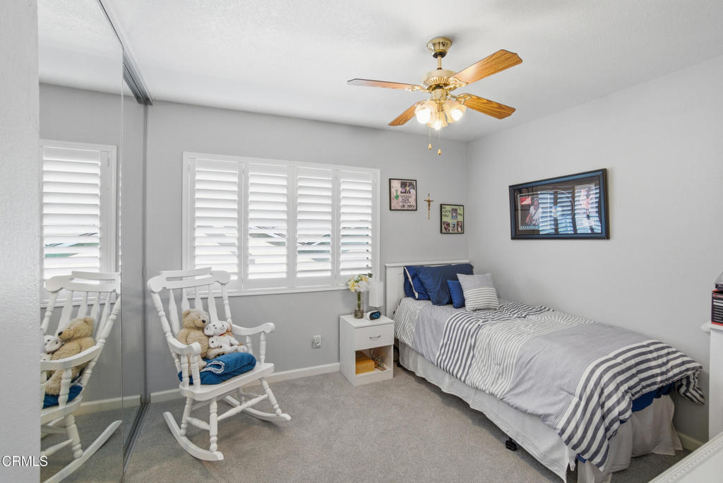 1288 Old Ranch Road Camarillo, CA 93012 - Photo 28 of 61 a bedroom with a bed and a chandelier
