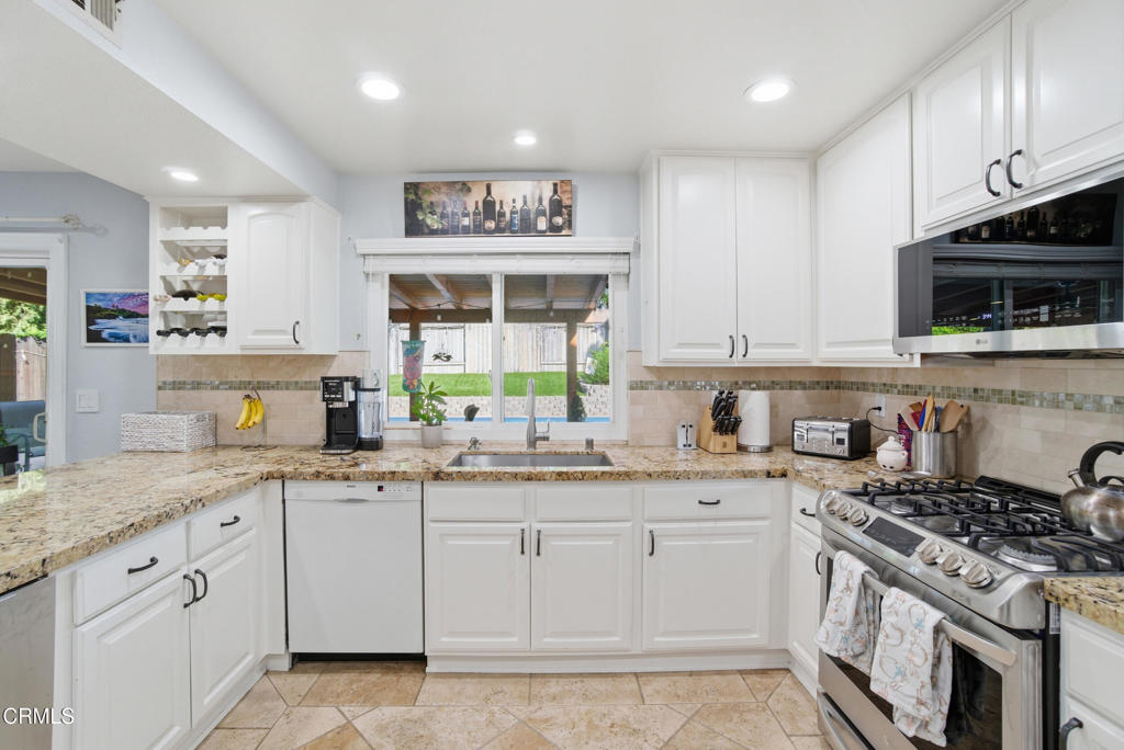 1288 Old Ranch Road Camarillo, CA 93012 - Photo 10 of 61 a kitchen with granite countertop cabinets stainless steel appliances and a sink