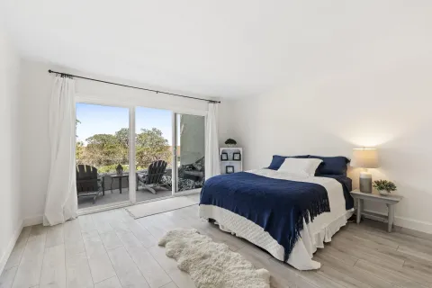 a bedroom with a bed and closet