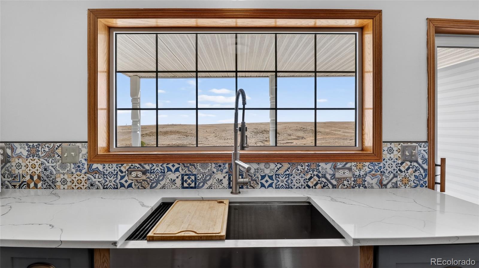 44166 East Iliff Trail Bennett, CO 80102 - Photo 13 of 50 a view of a sink and a window