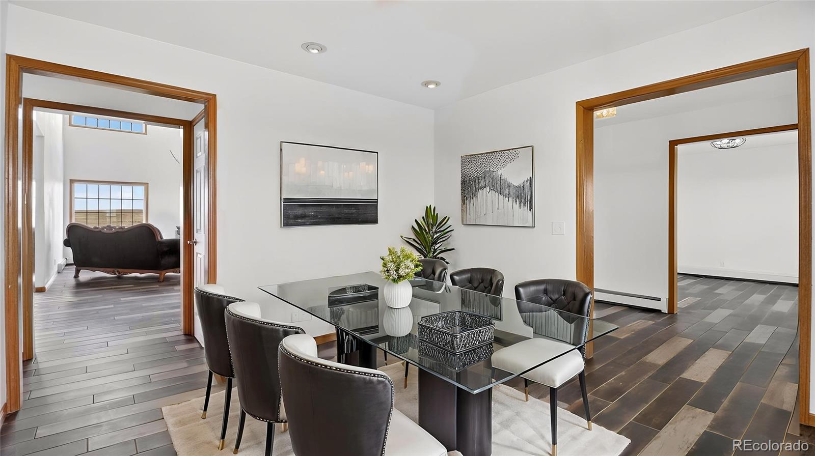 44166 East Iliff Trail Bennett, CO 80102 - Photo 14 of 50 a view of a dining room with furniture and wooden floor