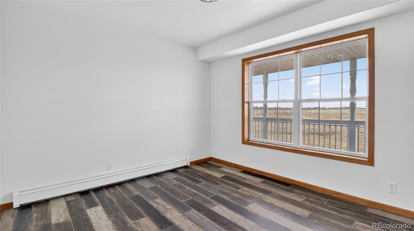44166 East Iliff Trail Bennett, CO 80102 - Photo 17 of 50 a view of an empty room with a window
